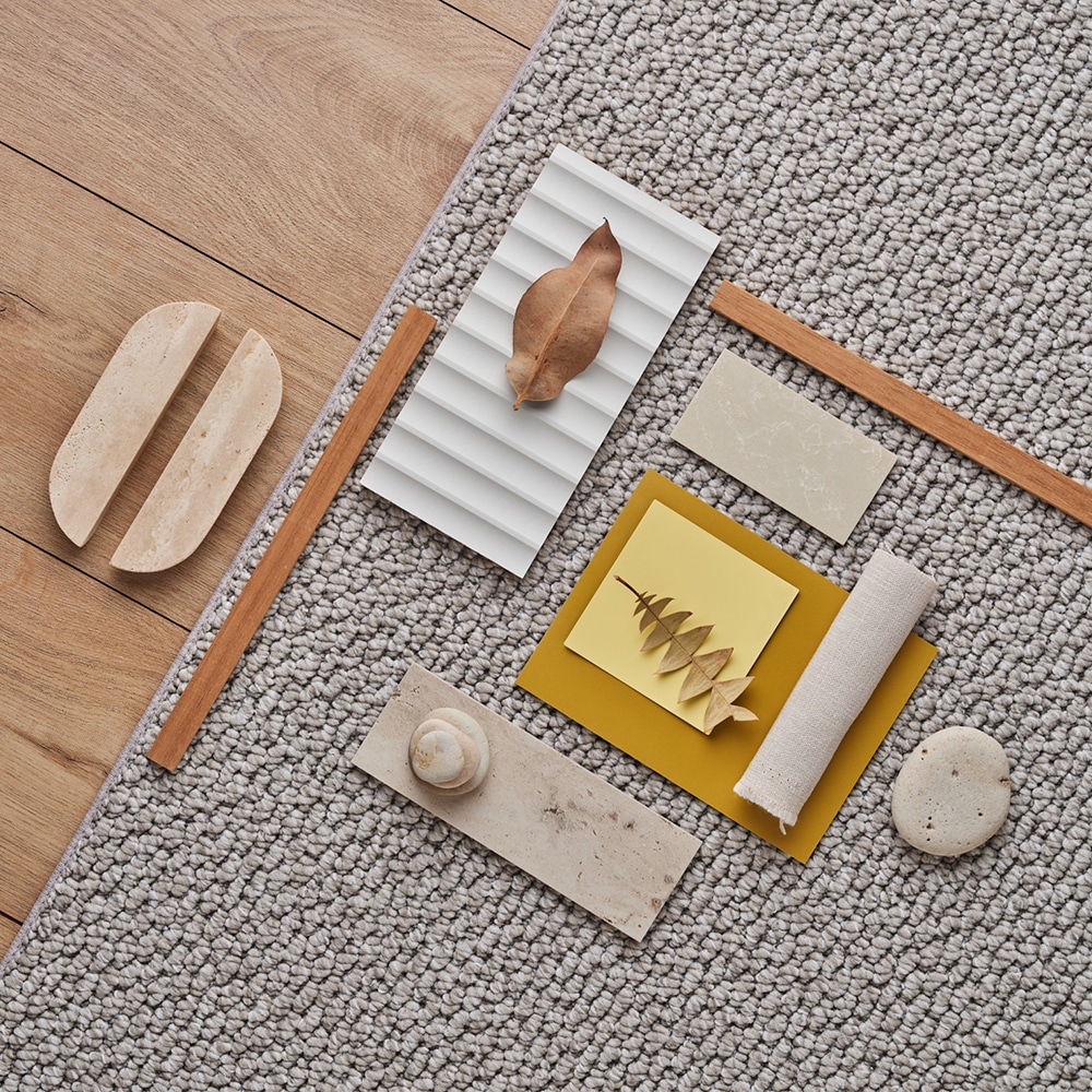 Andes Peak Pico: a textured wool rug flat-lay with travertine and timber accents