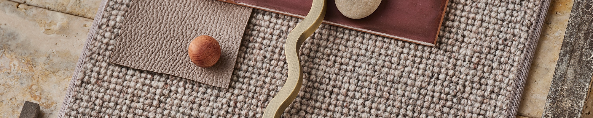 A styled room with a rug laid across a timber floor